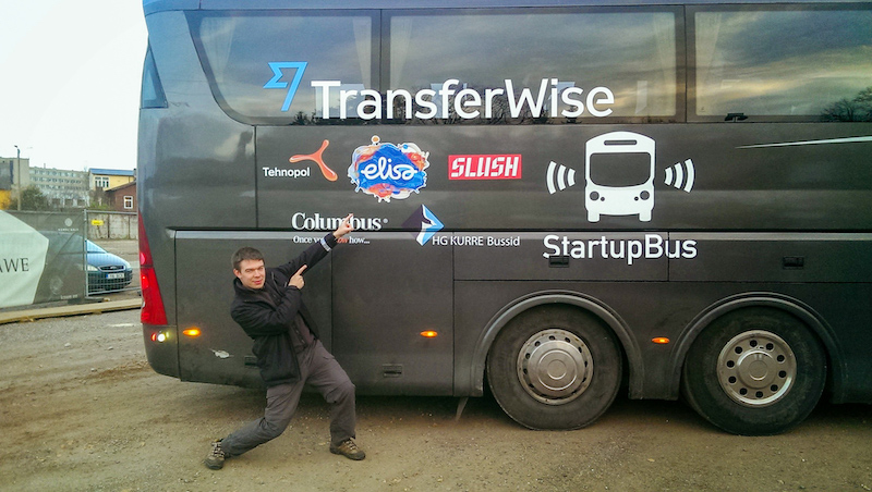 Alvar Lumberg standing in front of the TransferWise StartupBus